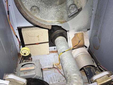 Same dryer cabinet after cleaning, blower wheel and internal duct clear of lint